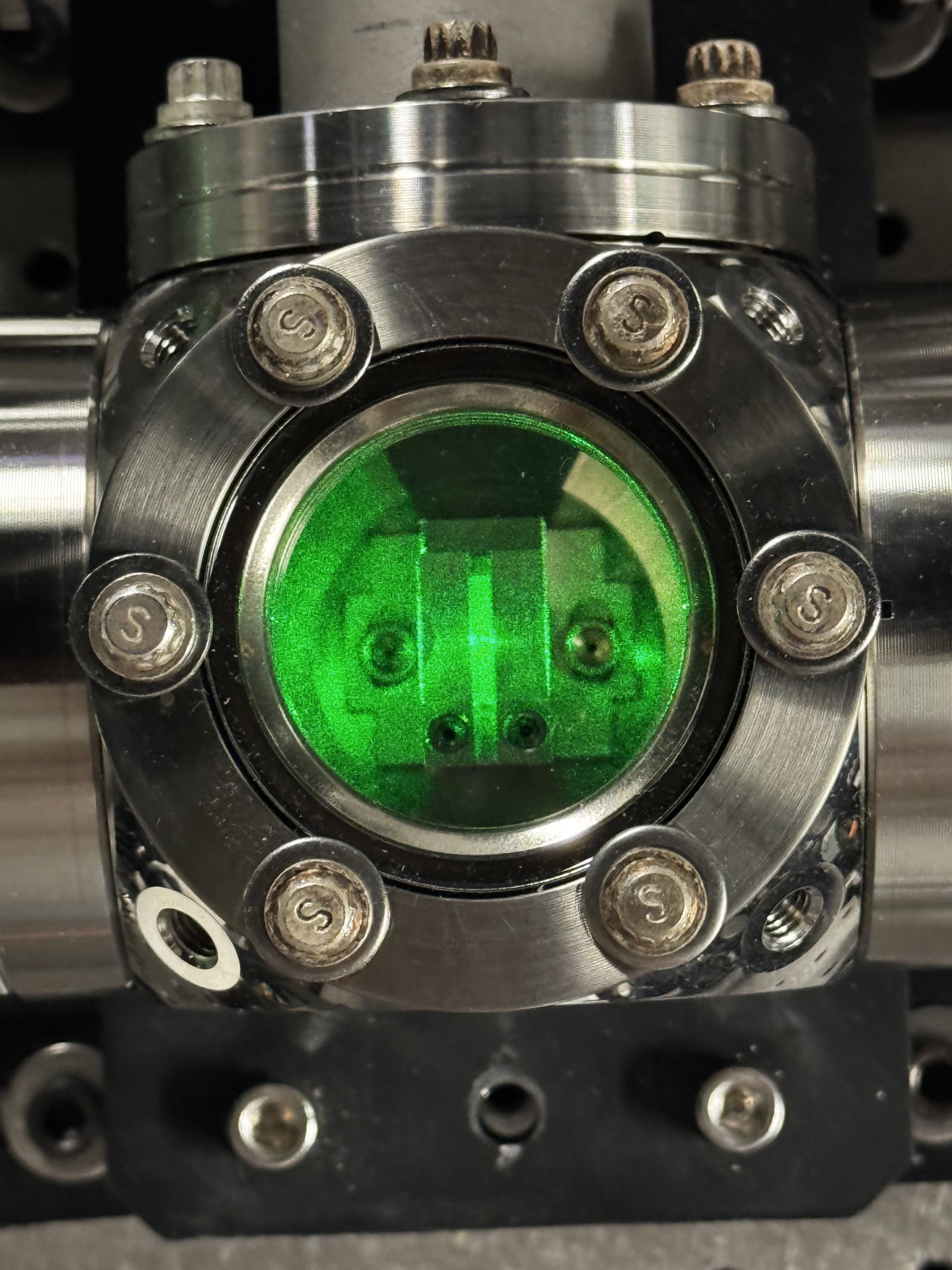 Top down view of the experimental setup showing the laser entry and detection ports.